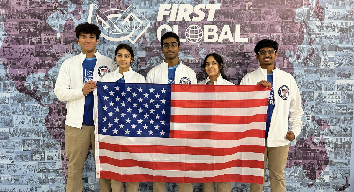 Senior Aneesh Depa, far right, and Team 12791 proudly hold the American flag. They represented Flower Mound as Team USA in Athens, Greece for the FIRST Global Challenge in late September. 